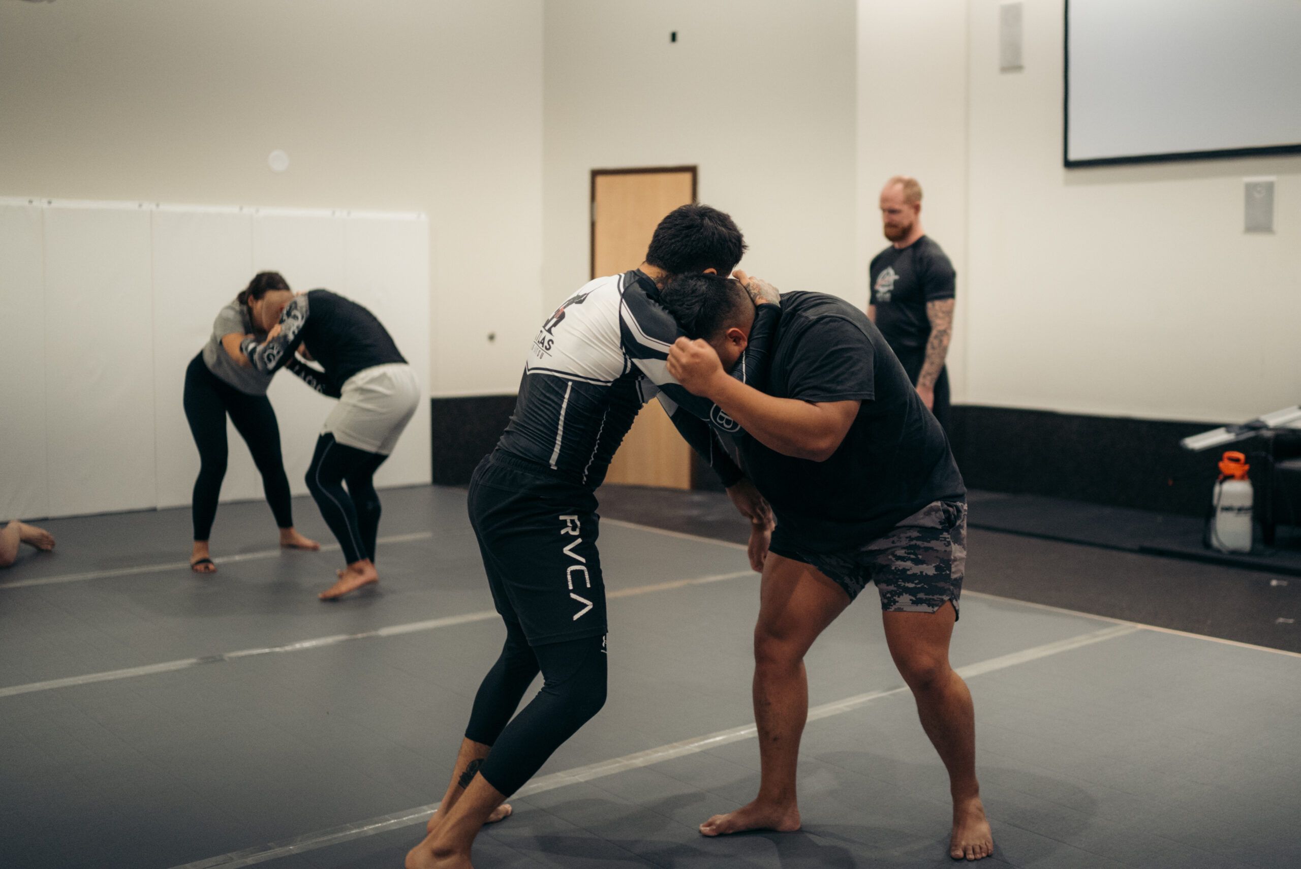 Two students hand-fighting for a takedown